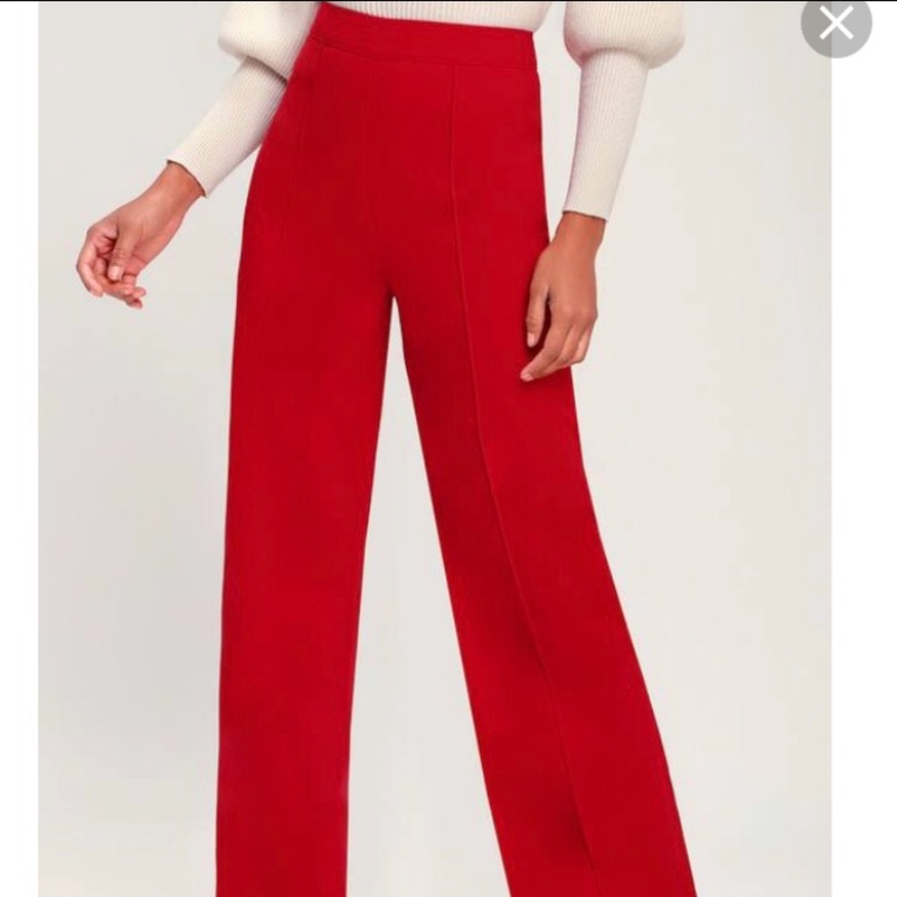 Wide-leg navy blue trousers.